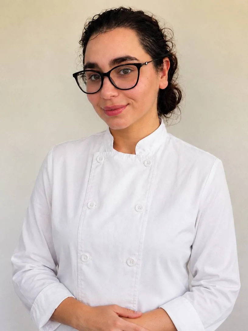 Chef Liza in a white chef coat