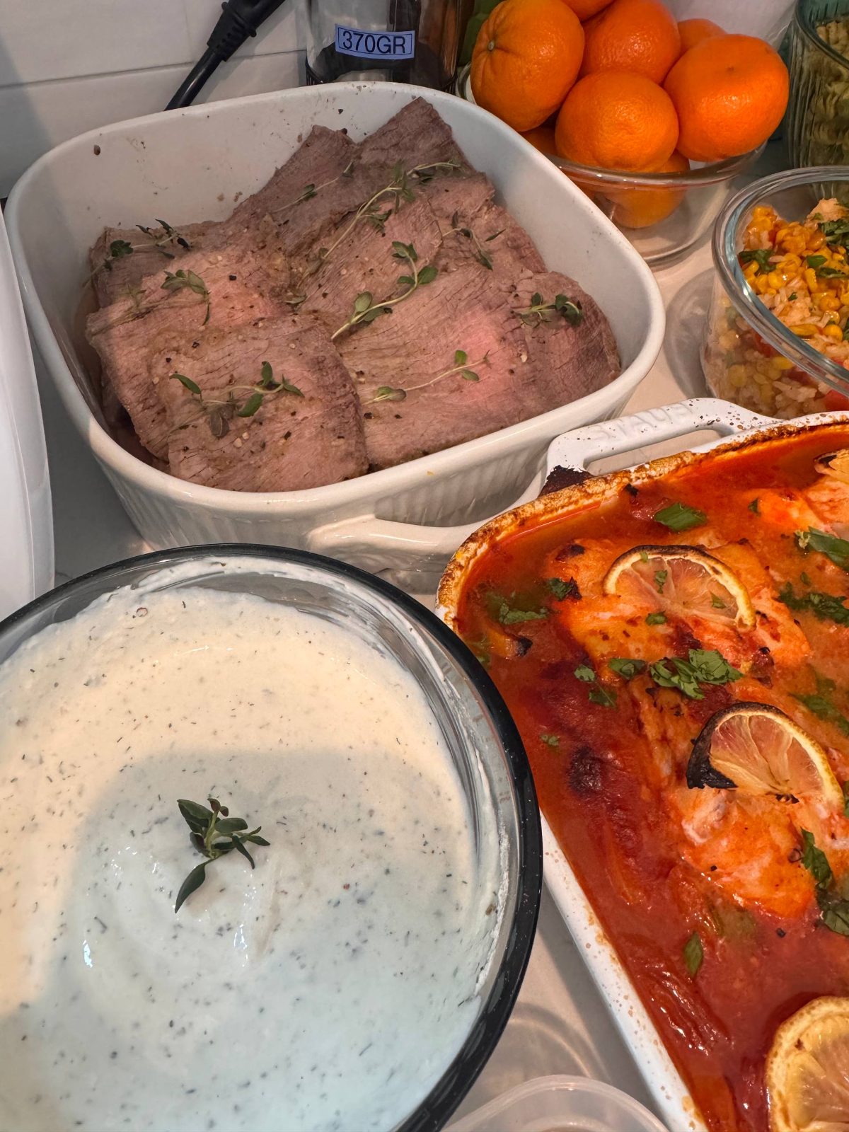 table with various dishes, including a bowl of meat