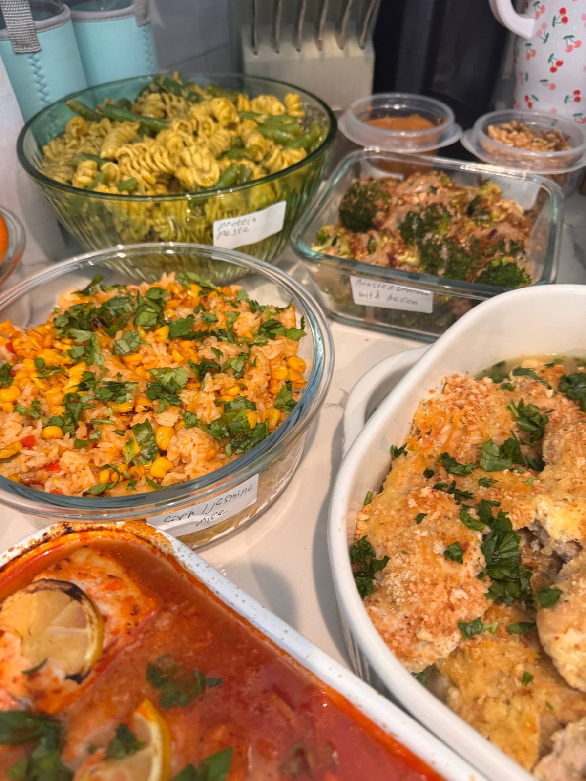 table with various dishes, including rice, pasta