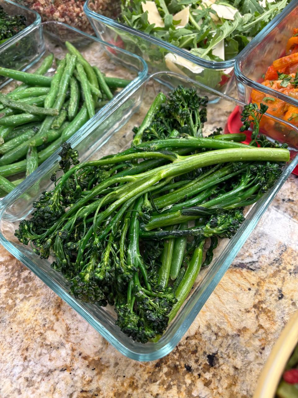 glass dish filled with broccoli and green beans