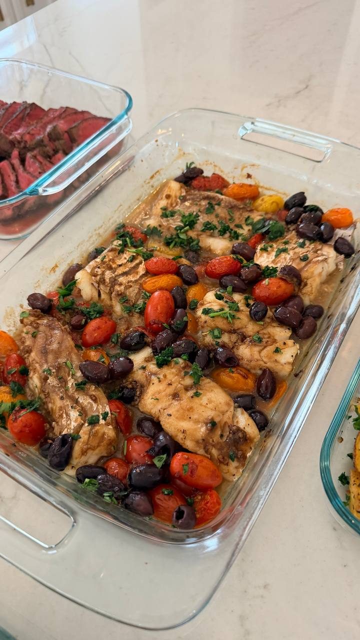 large glass dish filled with a variety of vegetables and meat