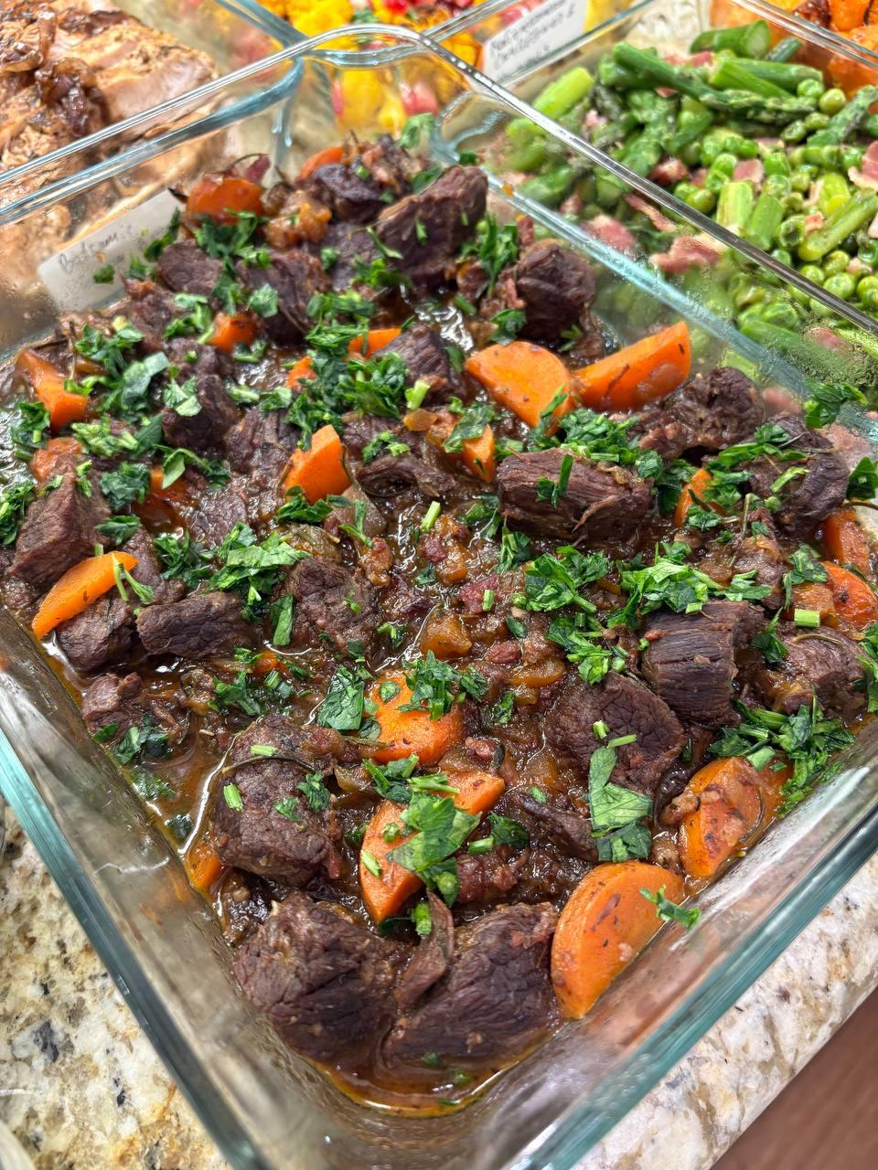 large glass dish filled with a delicious beef