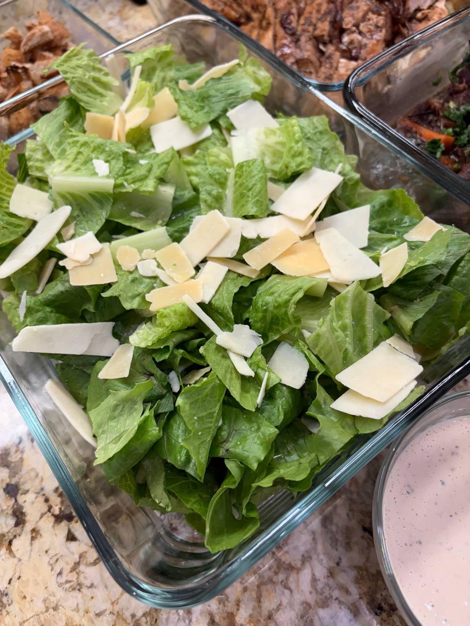 large salad with cheese and lettuce
