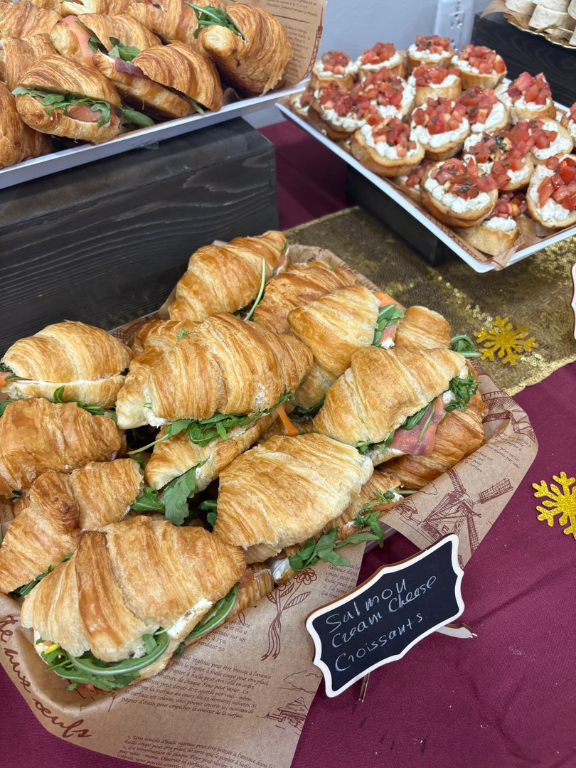 Basket of salmon cream cheese croissants and caprese bruschetta.