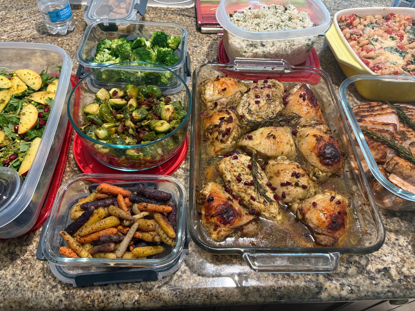 Family meal prep with roasted chicken, brussels sprouts, and white bean casserole.