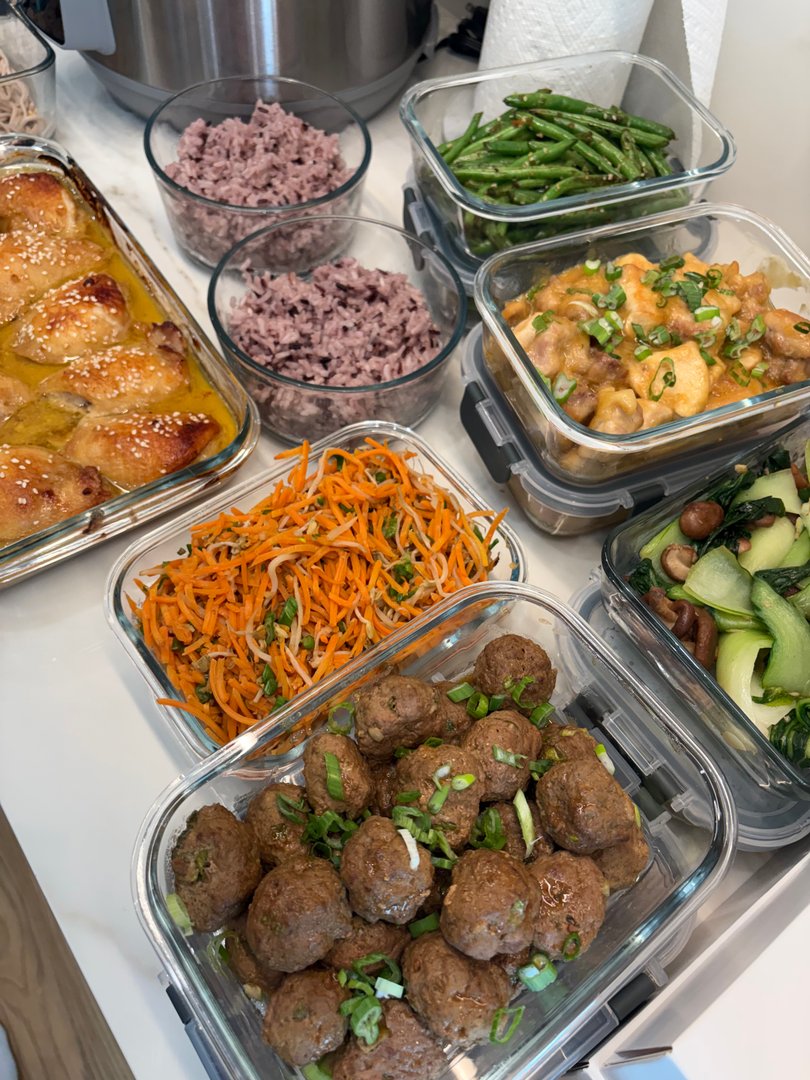 Full spread of Pan-Asian meal prep containers with meatballs and bok choy.