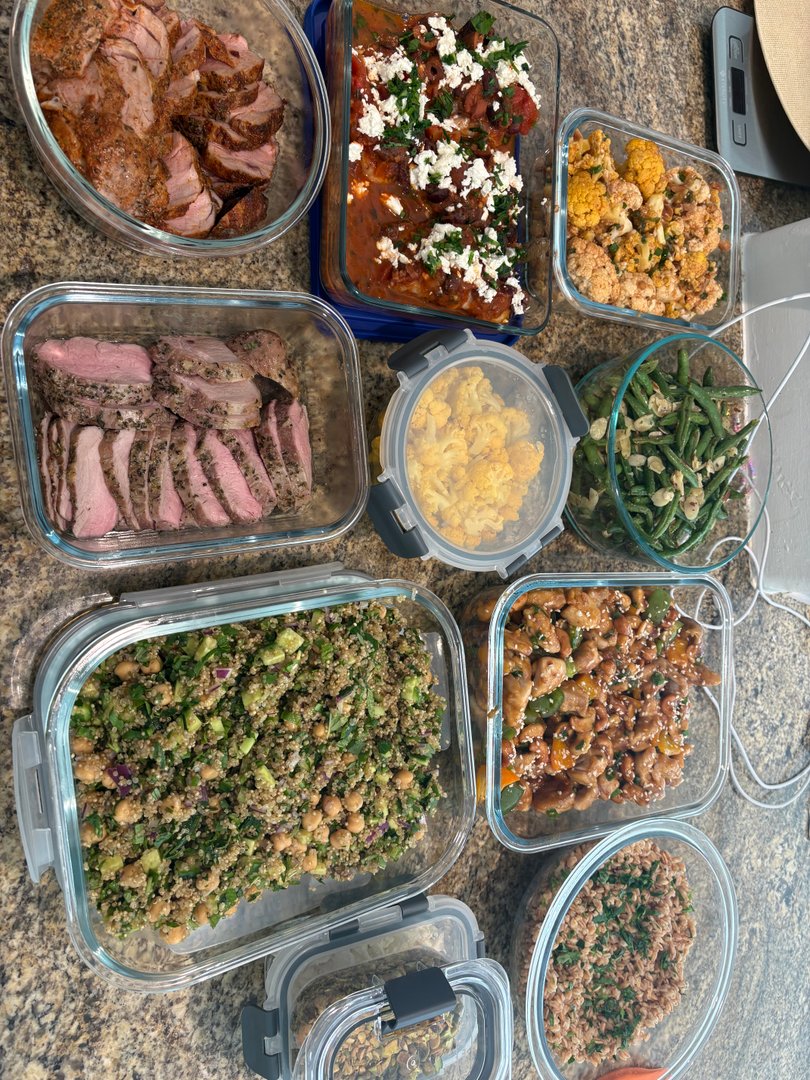 Overhead view of various meal prep dishes in glass containers