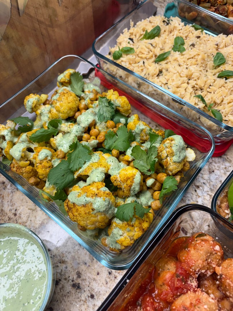 Roasted turmeric cauliflower and chickpeas with green sauce.