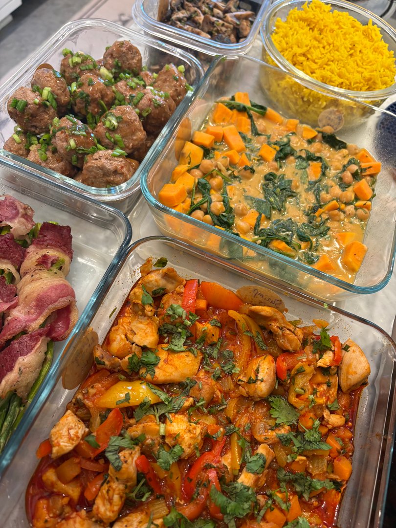 Overhead view of various meal prep dishes in glass containers.