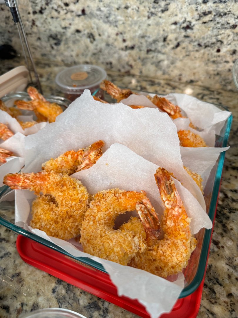 Baked panko-crusted shrimp with dipping sauce.
