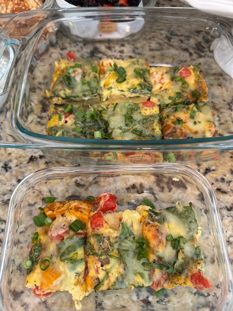 Savory egg frittata squares with spinach and bell peppers.