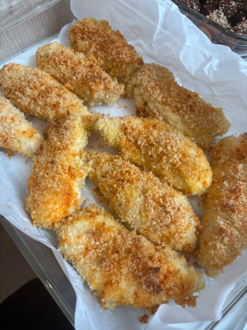 Tray of crispy, golden-brown panko-crusted chicken tenders.